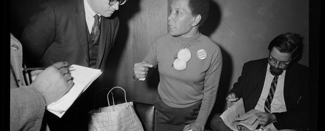 An unidentified woman, center, wears a "we shall not be moved" pin at a sit-in at the Boston Redevelopment Authority in April 1968.BREARLEY COLLECTION/BOSTON PUBLIC LIBRARY